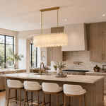 Scalloped White Marble Island Pendant installed above a kitchen island