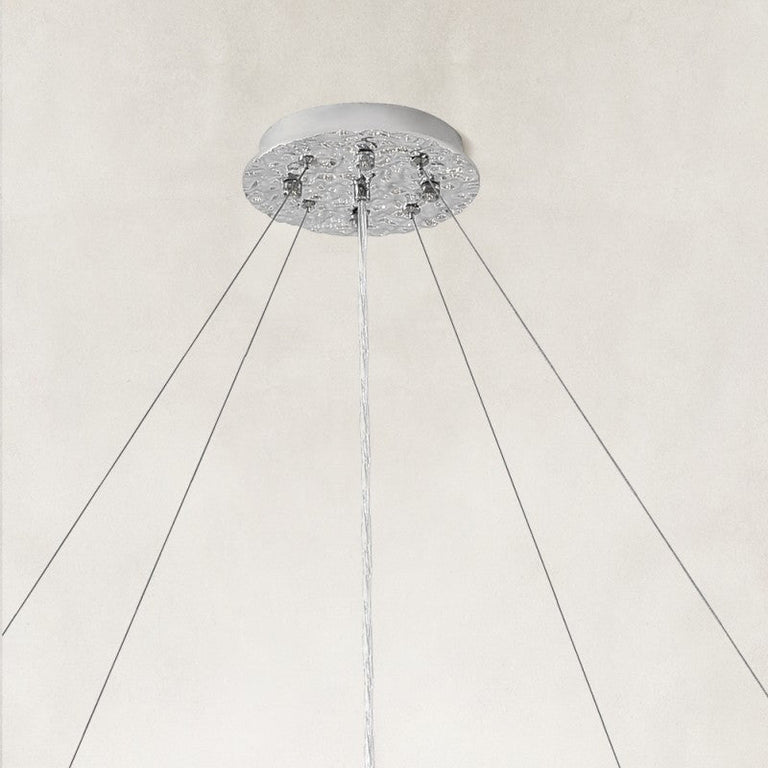 Silver-colored chandelier canopy and suspension cables.