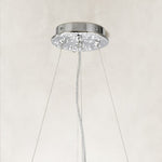 Silver-colored chandelier canopy and suspension cables.