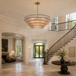 Smoke tiered-glass chandelier in an staircase foyer.