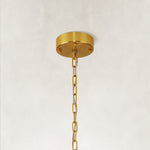 Single-tier panel chandelier, brass-tone canopy and chain.
