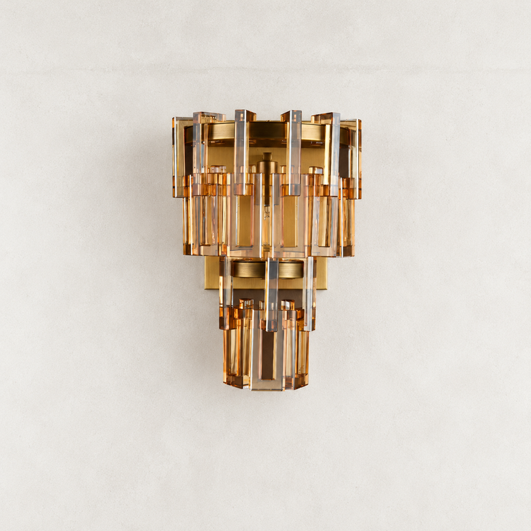 Amber crystal wall sconce with Brass-finish hardware, shown as a complete fixture