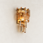 Amber crystal wall sconce with Brass-finish hardware, shown as a complete fixture