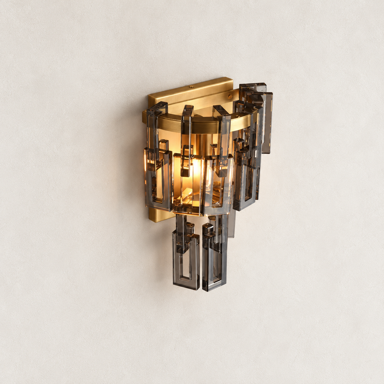 Smoke crystal wall sconce with Brass-finish hardware, shown as a complete fixture