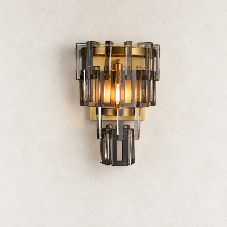 Smoke crystal wall sconce with Brass-finish hardware, shown as a complete fixture