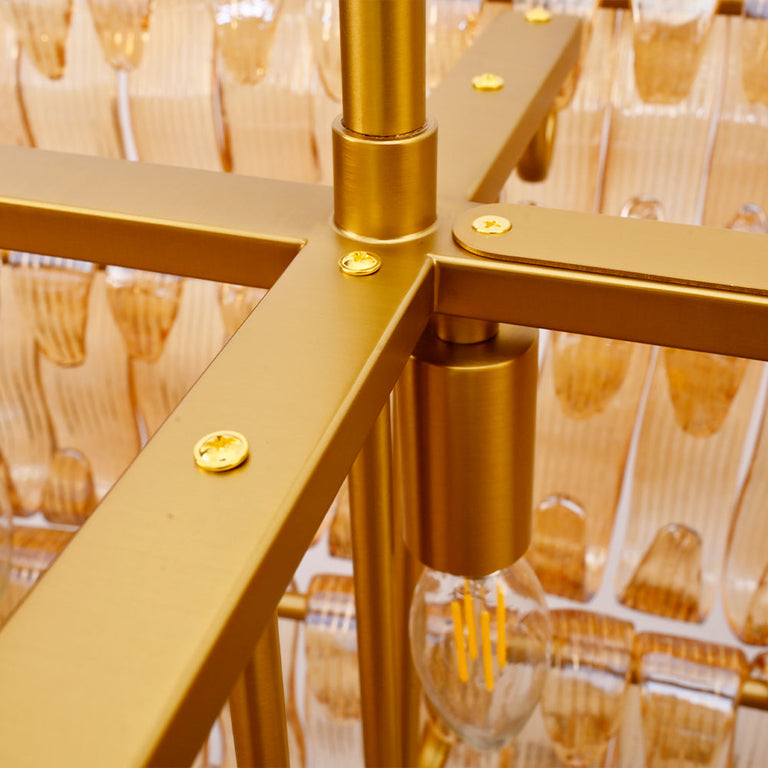 Support-frame junction inside the amber chandelier.