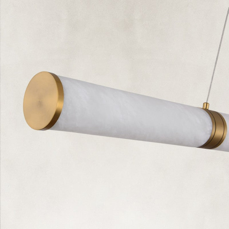 Gold-tone tube end cap close view