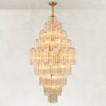 Tall Tiered Glass Chandelier illuminated