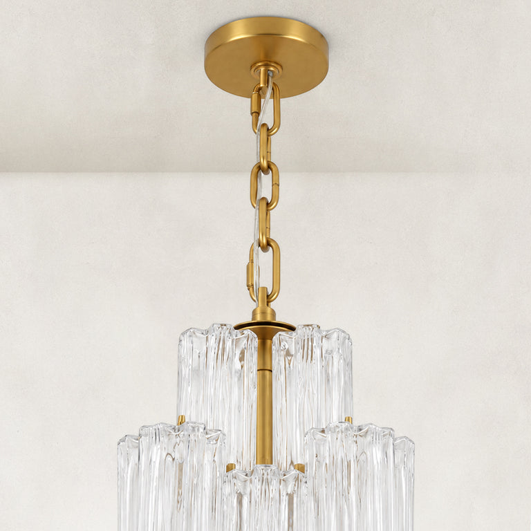 Ceiling canopy and suspension-chain detail of the tall glass chandelier