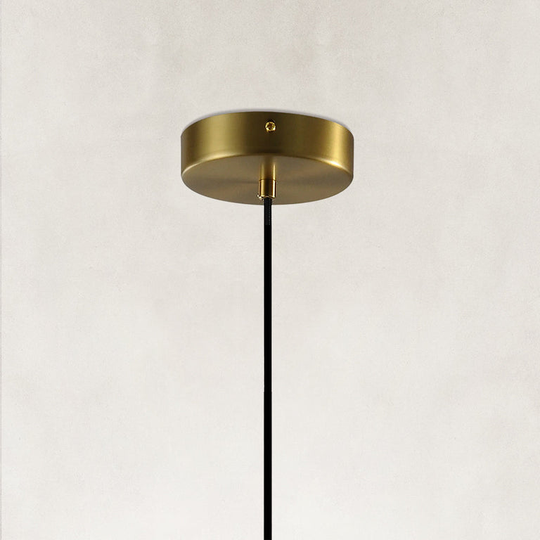 Brass-colored pendant canopy with a black suspension cable.