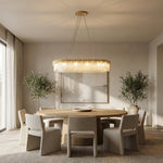 Gold-finish textured crystal glass chandelier above a dining table