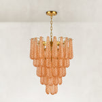 Amber textured glass cascade chandelier with Brass-finish hardware, shown as a complete fixture