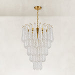 Clear textured glass cascade chandelier with Brass-finish hardware, shown as a complete fixture
