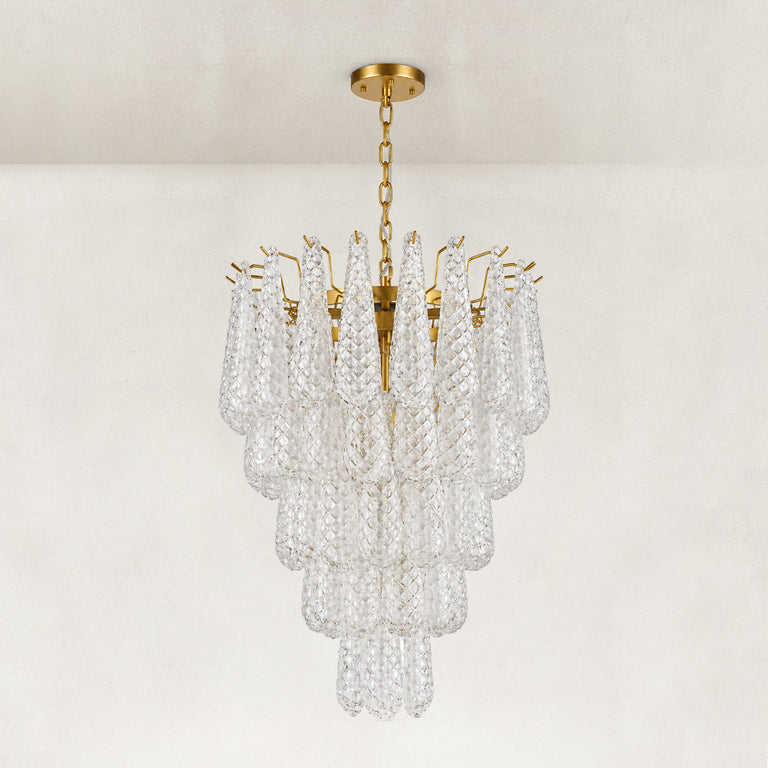 Clear textured glass cascade chandelier with Brass-finish hardware, shown as a complete fixture