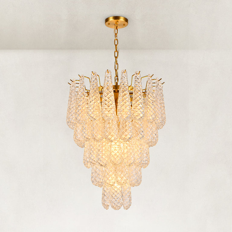Clear textured glass cascade chandelier with Brass-finish hardware, shown as a complete fixture
