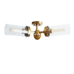 Brass-tone three-arm glass cylinder flush mount against a white background.