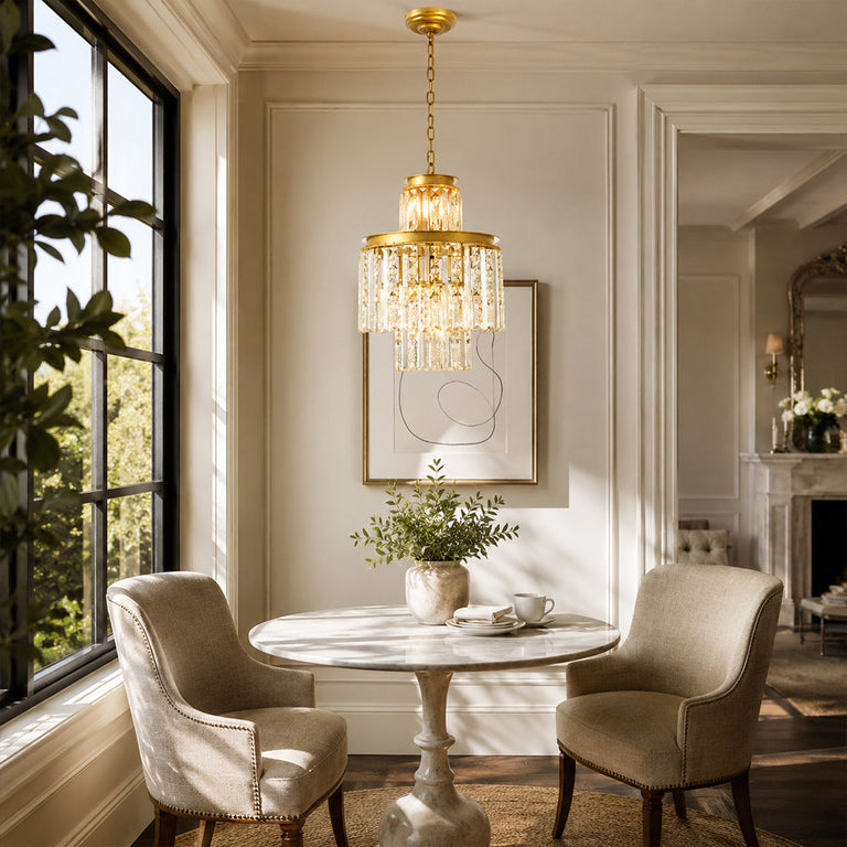 Compact crystal drum chandelier above a round dining table by tall windows.