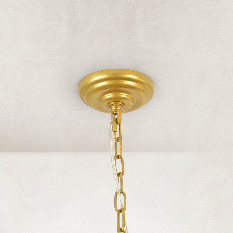 Compact crystal drum chandelier, gold-tone canopy and chain close view.