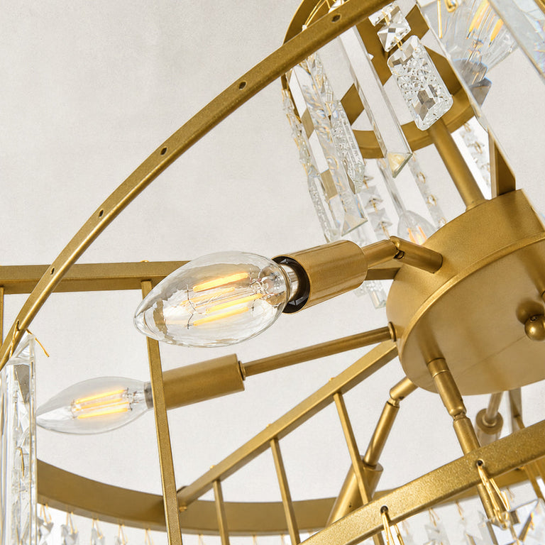 Tiered crystal drum chandelier, bulbs and gold-tone radial frame viewed from below.