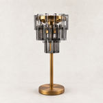 Smoke crystal table lamp with Brass-finish hardware, shown as a complete fixture