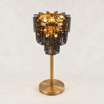 Smoke crystal table lamp with Brass-finish hardware, shown as a complete fixture