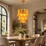 Tiered curved glass chandelier in a room setting