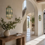 Tiered Marble-Composite Panel Wall Sconce displayed in an entryway interior