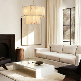 Brass two-tier stone drum chandelier in a furnished living room