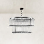 Black two-tier chandelier with vertical glass rods.