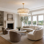 Gold-tone two-tier fluted glass chandelier in a room.