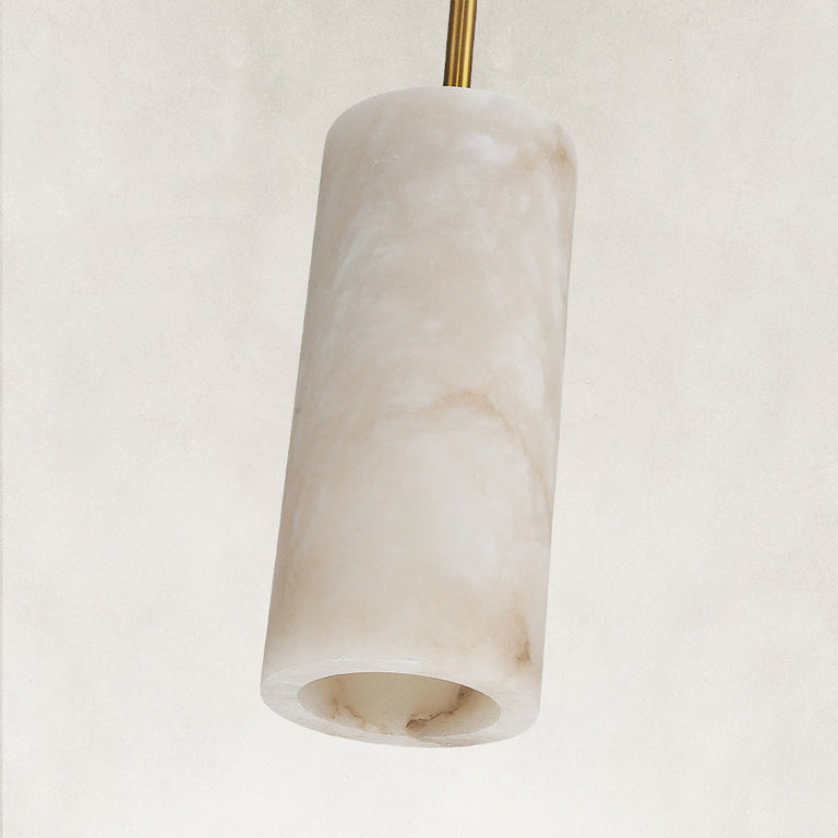 Unlit cylindrical stone pendant with a gold-colored rod.