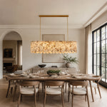 Variegated Scalloped Marble Island Pendant installed above a dining table