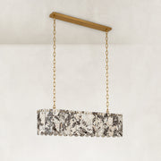 Product detail of Variegated Scalloped Marble Island Pendant against a neutral background