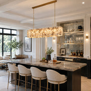 Variegated Scalloped Marble Island Pendant displayed in a furnished interior