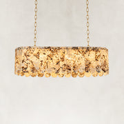 Product detail of Variegated Scalloped Marble Island Pendant against a neutral background
