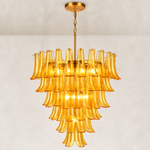 Large tiered amber chandelier with curved panels and gold-tone suspension.
