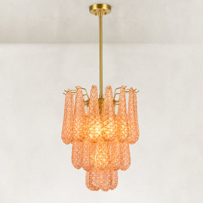 Illuminated chandelier with textured amber drops and a gold-tone ceiling canopy.