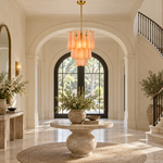 Textured amber chandelier in a neutral entryway.