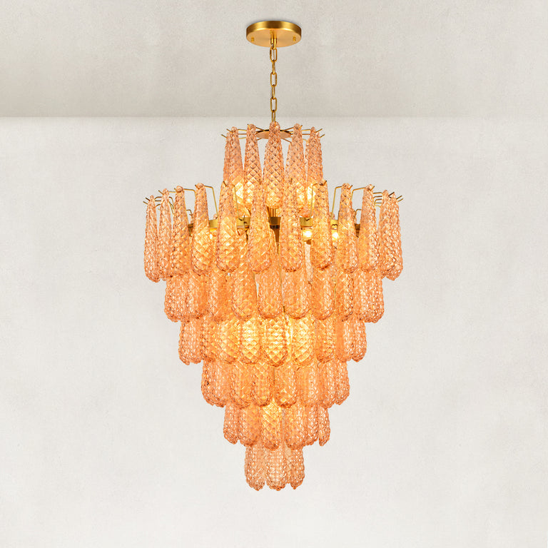 Tiered amber chandelier with a raised upper crown and gold-tone chain suspension.