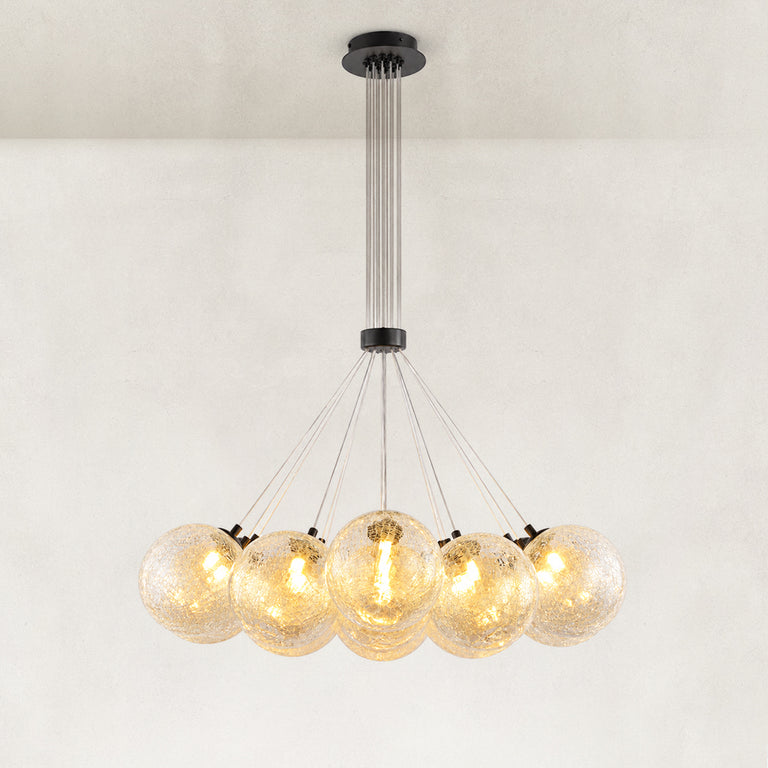 Illuminated glass globe chandelier with a black canopy and fanned suspension wires.