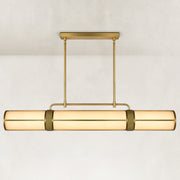 Linear pendant with a glowing cylindrical acrylic diffuser and two gold-tone suspension rods.